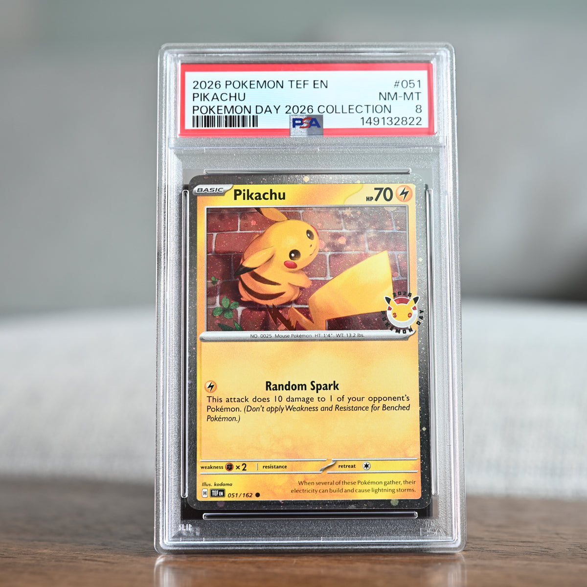 Pikachu (Pokemon Day 2026) 051/162 PSA 8